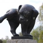 My Puppy Pees A Lot! How Often Should A Pup Urinate? Statue of dog peeing